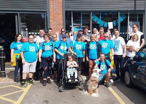 Leonie (6) and her family alongside Carol Garside, Co-op Store Manager who helped to organise the walk, Phil Cooper, Co-op Area Manager, and Co-op colleagues.