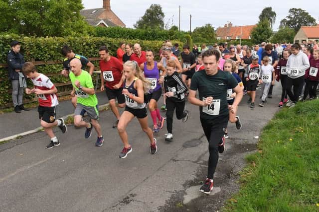 Charity 5 and 10k runs at Billingborough. Start of the 5k run. EMN-180827-155713001