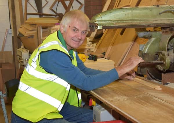 A smiling John Edwards is pictured during a typical day at work at E H Thorne (Beehives).