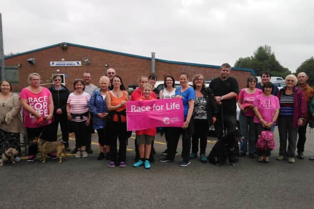 Members of the slimming groups stepping out to walk all over cancer