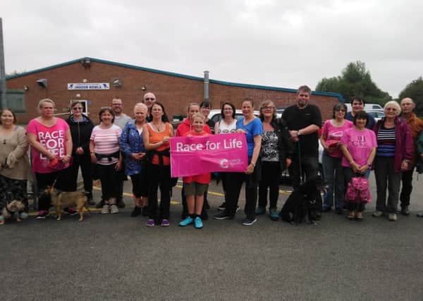 Members of the slimming groups stepping out to walk all over cancer