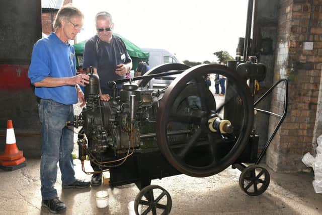 Heckington Windmill director Jim Bailey (left) with Pete Lett (right) with the Ruston and Hornsby 2XHR static engine that was later installed to drive mill stones in the absence of wind for the sails. EMN-180829-113628001