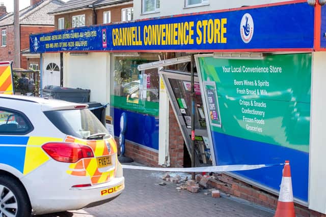 Wrecked - the caved in shop front at Cranwell Convenience Store. Photo: John Aron