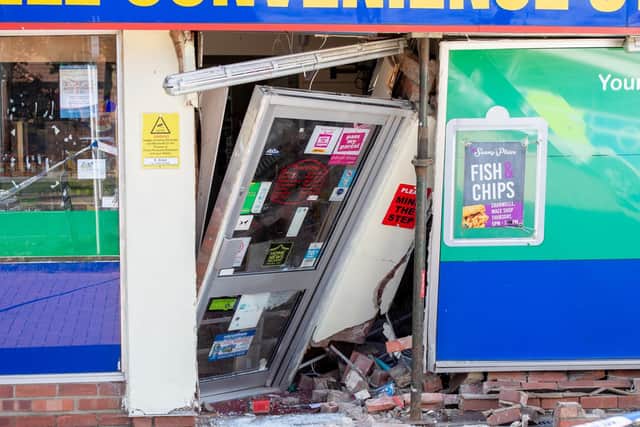 The doorway of the store at Cranwell was rammed into the shop by the raiders. Photo: John Aron