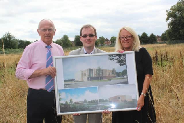 Coun Jeff Summers, Coun Thomas Smith and Karen Whitfield with the leisure centre plans.