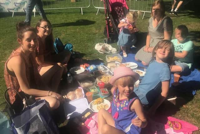 Zara Slaney (left) with  friends Tasmin Butlins and Sharon Steel and their families. ANL-180309-124011001
