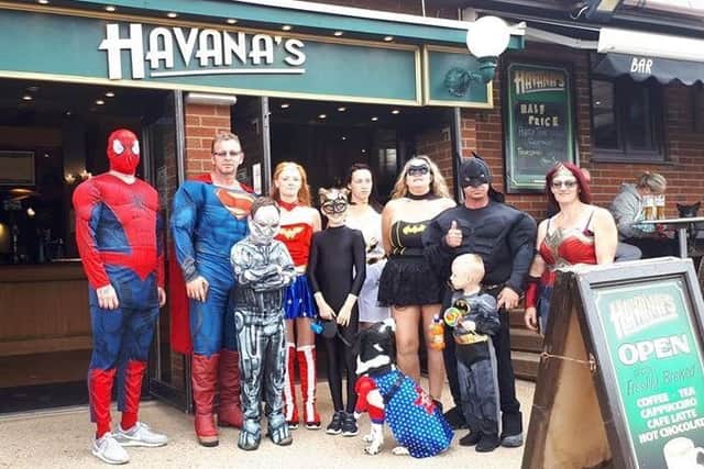 The 'superheroes' pictured outside Havana's Bar in Ingoldmells - which made a donation to them on the day.