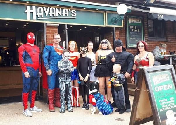 The 'superheroes' pictured outside Havana's Bar in Ingoldmells - which made a donation to them on the day.