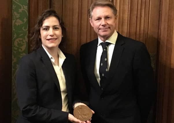 Victoria Atkins MP and  David Morris MP with the Dead Man's Penny of Private Charles Edward Woodward from Spilsby ANL-180409-082808001
