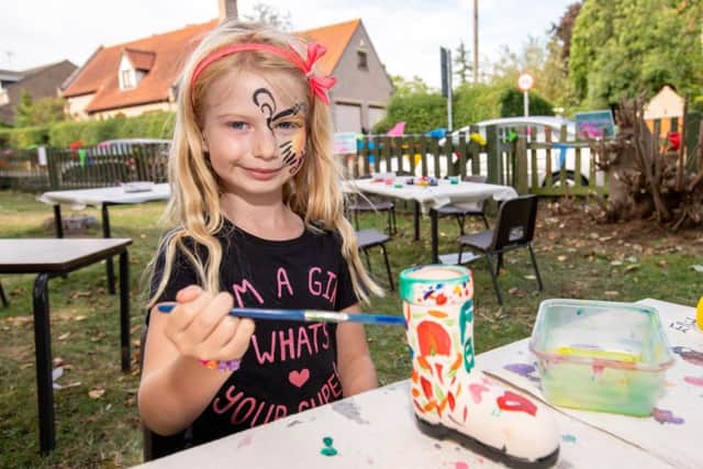 Lillyann Lees age 6 painting a wellie at the Duke of Wellington fun day. EMN-180409-120821001