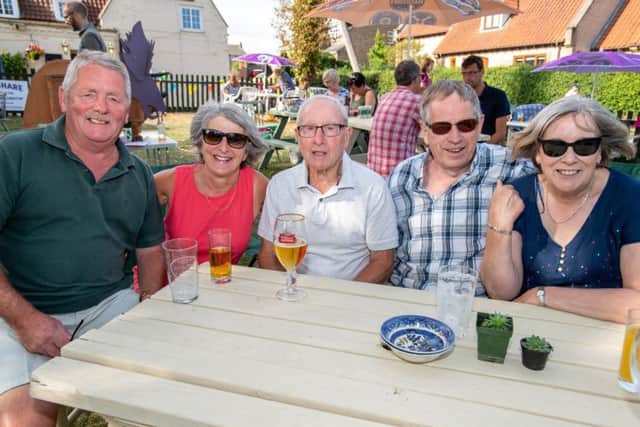 Enjoying a drink at the Duke of Wellington fun day. EMN-180409-120736001