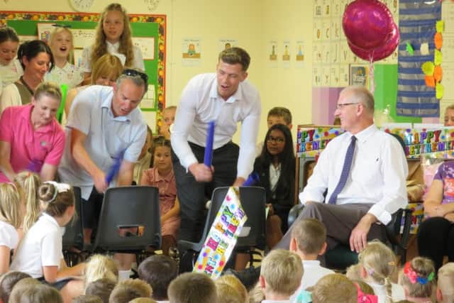 The school making presentations to Mr Lister (far right) on his retirement. Images supplied.