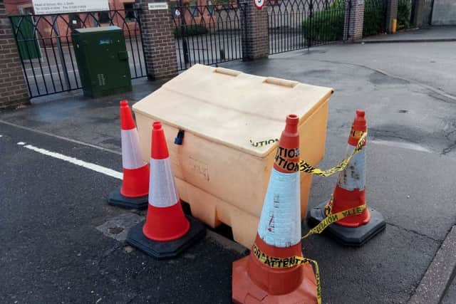 Cones and a grit bin have been dragged across to prevent people falling into the dangerously exposed manhole left by thieves in Jermyn Street, Sleaford. EMN-180709-104410001