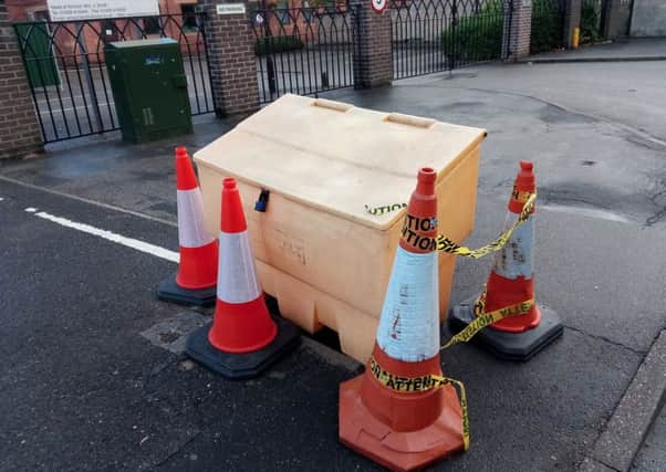 Cones and a grit bin have been dragged across to prevent people falling into the dangerously exposed manhole left by thieves in Jermyn Street, Sleaford. EMN-180709-104410001