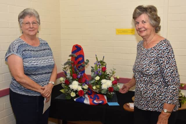 Chris Raynor, left, chairman of Barkwith & District Gardeners Association pictured with Ann Needham, who came second in the floral art with her display Salute to the RAF 100 Years with flowers. EMN-180709-120333001