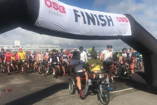 Mark andf Ryan Smith starting the fourth annual Riding for Ryan event at Fantasy Island's Bike Fest 2018 in Ingoldmells. ANL-180909-165348001