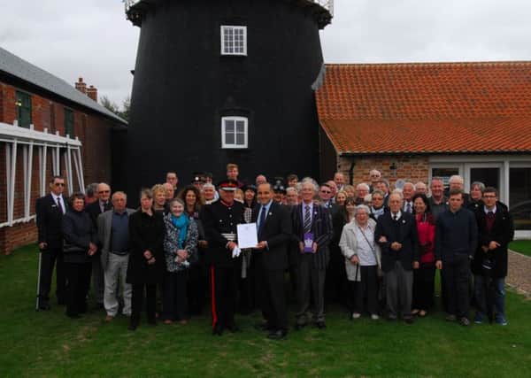 Heckington Windmill Trust volunteers celebrate their award. EMN-181009-155426001