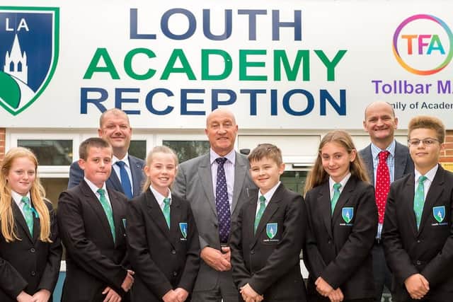 Year 8 students Lexie Waldron, Bradley Wraith, Evie Wood, Callum Jones, Lakeisha Goodyear and Teo Gordon, alongside Rob Colbert (Vice Principal), David Hampson OBE (CEO, Tollbar MAT), and Martin Brown (Executive Principal Louth Academy).