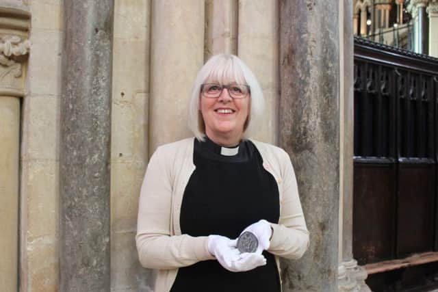 The Dean of Lincoln Cathedral with the seal matrix