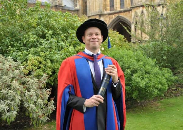 Robert Webb with his degree from the University of Lincoln today (Tuesday).