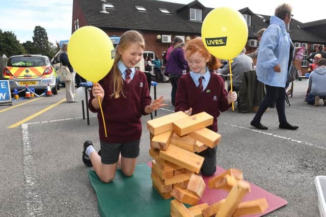 Sleaford Medical Group fun day. Members of William Alvey school choir that performed at the event L-R Tabitha Goode 10 and Katie Cowley 10. EMN-180917-121028001