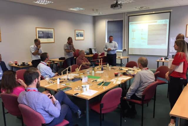 Teachers from the Haven High Academy, Boston Grammar and Boston
High School discuss fluid power engineering as part of the previous workshop