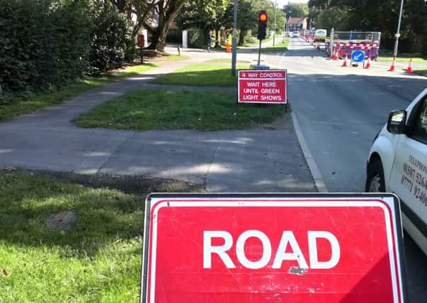 Road closed signs at Langton Hill. EMN-180913-145114001