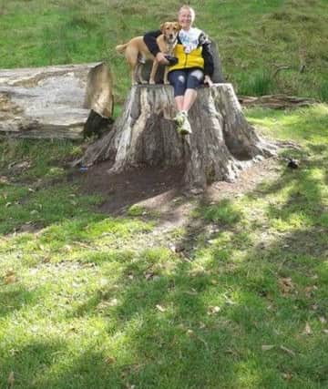 Sally Douglas out walking with her pet, Cadbury, who has sadly died after swallowing a fishing hoook.. ANL-180920-154434001