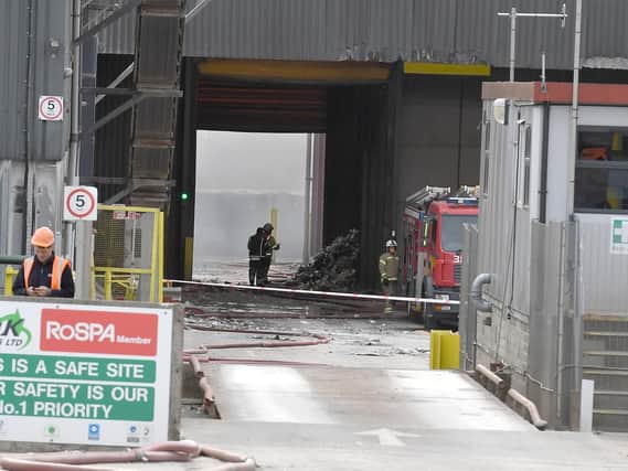 Firefighters continue to work on the site of the major fire at Mid UK Recycling's plant at Barkston Heath, near Ancaster. It is thought to have been sparked by a lithium battery within the kerbside recycling waste.