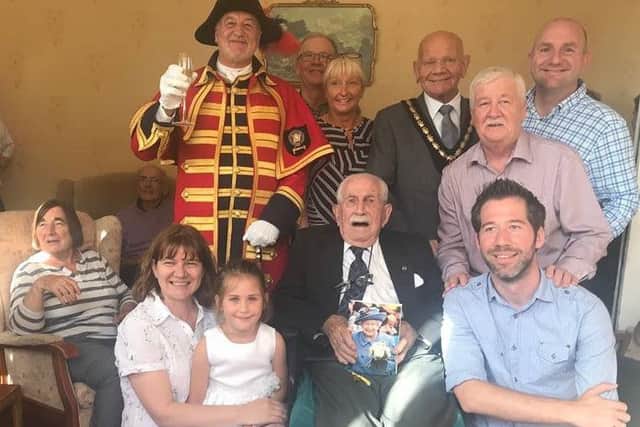 John Gill celebrating his 100th birthday with friends and family, the Mayor of Skegness Coun Sid Dennis and Town Crier Steve ODare. ANL-180917-175637001