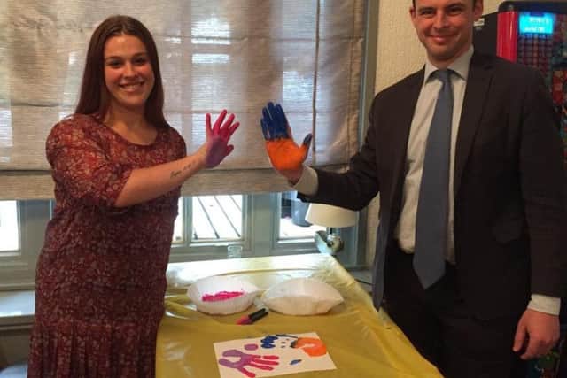 Skegness mum Shannon Elliott with MP for Boston and Skegness Matt Warman hand-printing to make a banner for a protest march in Boston to save services at the Pilgrim Hospital children's ward. ANL-180917-125628001