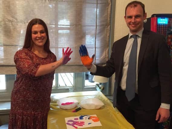 Skegness mum Shannon Elliott with MP for Boston and Skegness Matt Warman hand-printing to make a banner for a protest march in Boston to save services at the Pilgrim Hospital children's ward. ANL-180917-125628001