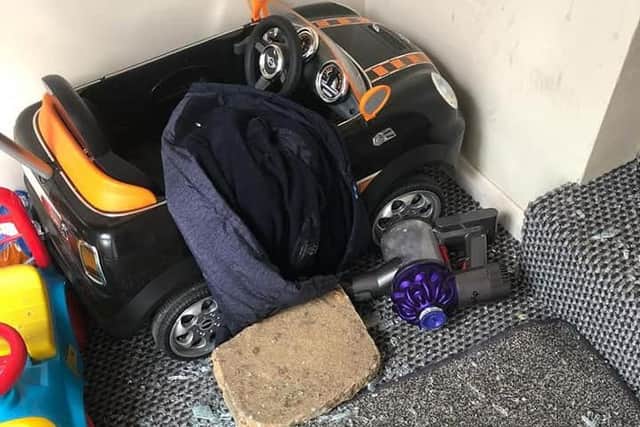 Shattered glass on Georgina's son's toys