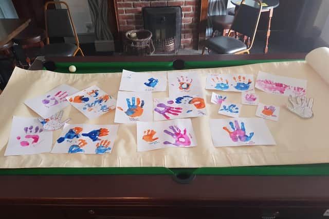 A handprint banner made for the march