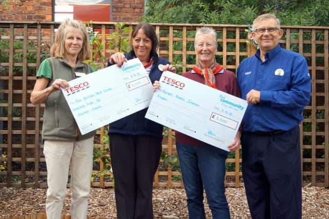 Recipients of the latest round of Bags of Help initiative at Market Rasen's Tesco store EMN-180918-101721001