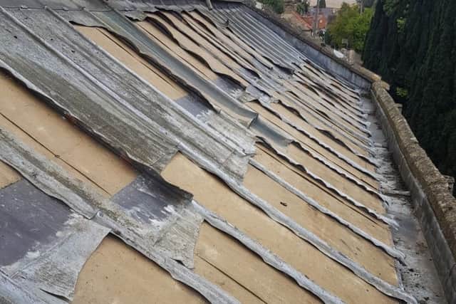 The roof at Wilsford Church with the remaining jagged strips of lower grade lead that were left behind by the thieves. EMN-180925-112955001