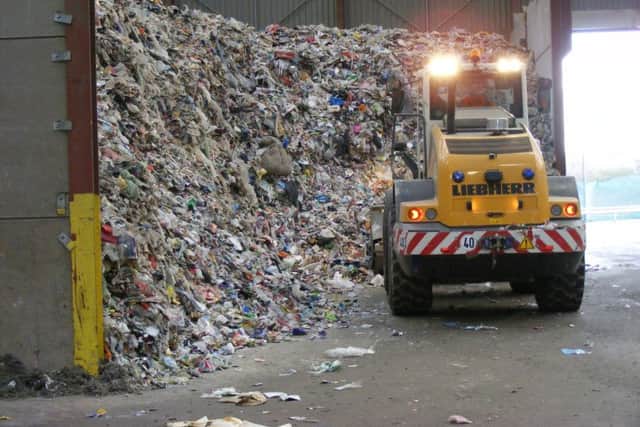 Mountains of recyclable waste waiting to be sorted at Mid Uk's plant. EMN-180919-095748001
