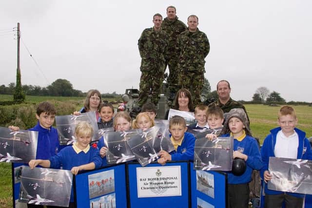 Toynton All Saints Primary School pupils and an RAF bomb disposal unit from RAF Coningsby 10 years ago.