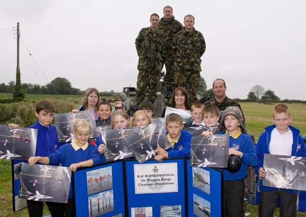 Toynton All Saints Primary School pupils and an RAF bomb disposal unit from RAF Coningsby 10 years ago.