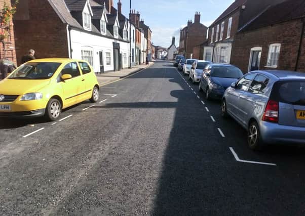 The  freshly painted bays in a re-surfaced West Street where it is claimed residents are struggling to park.