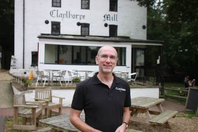 Owner Mike Agate outside of the mill.