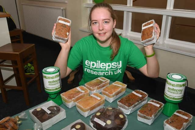 Rachel at the cake stall which helped to raise more money for the charity.