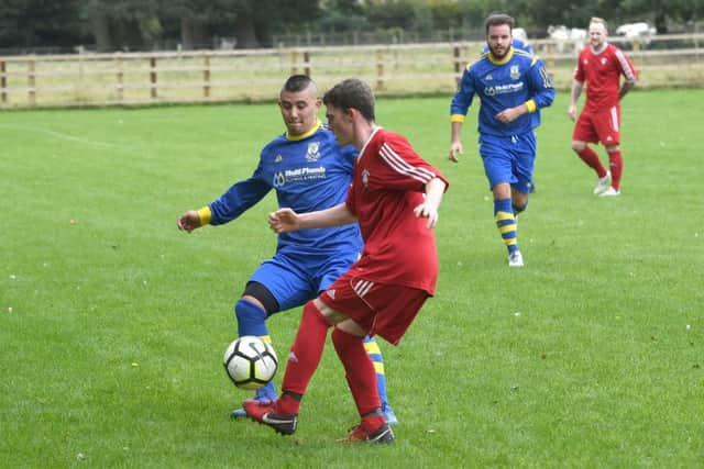 Carrington (blue) v Fishtoft (red). Ben Liu (blue), Kyle Tate (red).