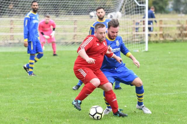 Carrington (blue) v Fishtoft (red). Ben Dean (blue), Christian Parker (red).
