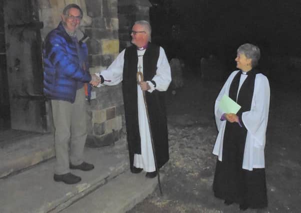 The Bishop and the Rev Sam Parsons greet Brian Wookey of Thimbleby after the service. Picture: Bob Wayne.