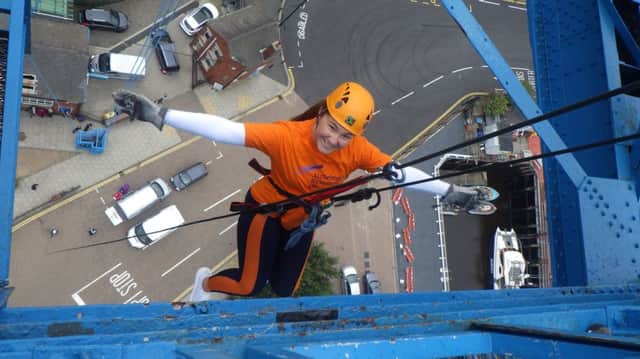 Evie Shaw (16) begins her abseil on the Middlesbrough Transporter Bridge. DDpWKSM7aFz9ERTYQTj2