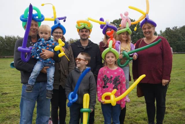 Balloon-modelled hats proved popular with all ages EMN-180924-181203001