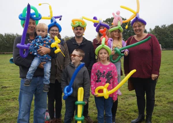 Balloon-modelled hats proved popular with all ages EMN-180924-181203001