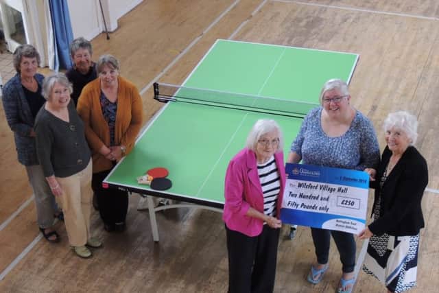 Chairman of Wilsford village hall committee, along with fellow committee members, receives a ?250 donation from secretary Rosie Smith and chairman Jo Leatherland of the Isaac Newton Lodge of the Oddfellows friendship group of Grantham. The money goes towards a new table tennis table and replacement upper windows for the hall, along with ?250 dontaed by the Tesco Bags for Life scheme. EMN-180920-172031001