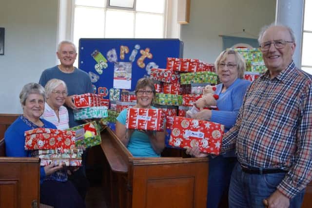 Wrappers and packers with some of the boxes filled on Saturday morning in Market Rasen Methodist Church EMN-180110-062301001